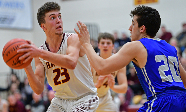 CANFIELD, OHIO - JANUARY 29, 2019: South Range's Jaxon Anderson goes to the basket against Poland's Adam Kassem during the first half of their game, Tuesday night at South Range High school. DAVID DERMER | THE VINDICATOR