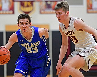 CANFIELD, OHIO - JANUARY 29, 2019: Poland's Michael Cougras drives on South Range's Ben Irons during the second half of their game, Tuesday night at South Range High school. DAVID DERMER | THE VINDICATOR