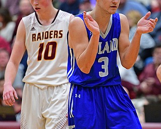 CANFIELD, OHIO - JANUARY 29, 2019: Poland's Braeden O'Shaughnessy celebrates after hitting a three point shot over South Range's Chris Brooks during the second half of their game, Tuesday night at South Range High school. DAVID DERMER | THE VINDICATOR