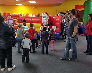 Neighbors | Submitted.Santa Claus visited with 120 children who attended Austintown Bounce's Christmas party Dec. 15.