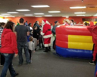 Neighbors | Submitted.120 children and their families attended Austintown Bounce's Christmas celebration Dec. 15, visiting with Santa Claus and enjoying free snacks and snow globes.
