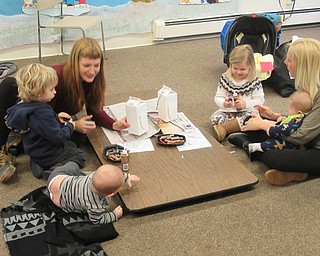 Neighbors | Jessica Harker.Children who attended the Mill Creek Park's Tales for Tots event created bird feeders from recycled material on Jan. 18.