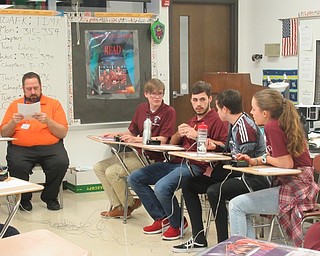 Neighbors l Jessica Harker .Members of the Boardman Quiz Bowl team contemplated a question posed by Poland teacher and coach Scott Suchora on Jan. 16.