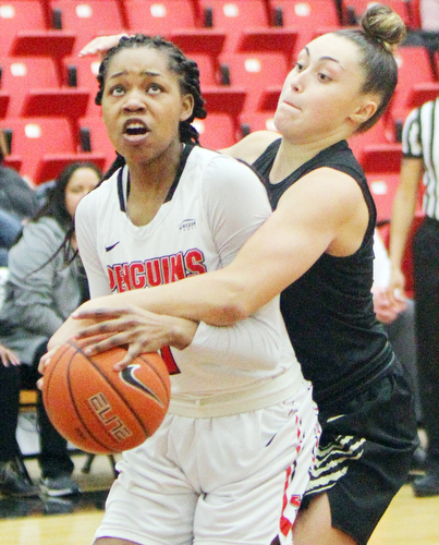 William D. Lewis The Vindicator YSU's Amara Chikwe(1) keeps the ball from Oakland's Chloe Guingrich(34) during 1-31-19 action at YSU.