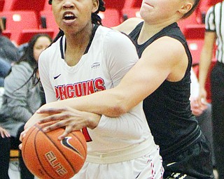 William D. Lewis The Vindicator YSU's Amara Chikwe(1) keeps the ball from Oakland's Chloe Guingrich(34) during 1-31-19 action at YSU.