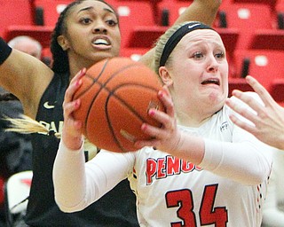 William D. Lewis The Vindicator YSU'sMcKenah Peters(32) drives around Oakland's Taylor Jones(10) during 1-31-19 action at YSU.