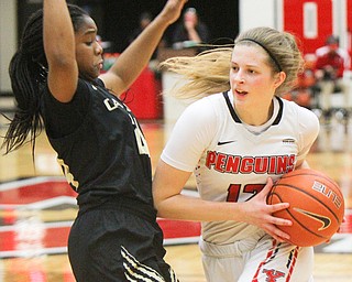 William D. Lewis The Vindicator YSU's Chelsea Olson(12) drives around Oakland's Brianna Breedy(24) during 1-31-19 action at YSU.