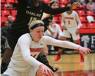 William D. Lewis The Vindicator YSU's McKenahj Peters(34) keeps the ball from  Oakland's Nikita Telesford(12) during 1-31-19 action at YSU.