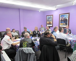 Neighbors | Jessica Harker.Members of the Austintown School's principal team, local veterans, students and representatives from the ODE Purple Star Committee gathered together at Austintown Fitch High School's Purple Star Room Jan. 23.