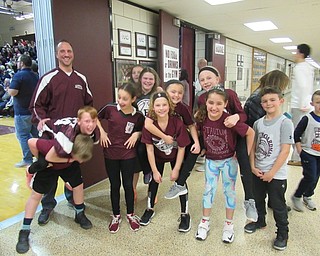 Neighbors | Jessica Harker.Principal Mike Zoccali posed with Stadium Drive students Jan. 25 as they prepared to compete against the other elementary school's at the high school basketball team's annual Elementary School Night.