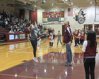 Neighbors | Jessica Harker.Stadium Drive Elementary School Principal Mike Zoccali rebounded basketballs as students competed to make the most baskets Jan. 25 at the Boardman High School basketball team's Elementary school night.