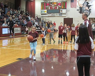 Neighbors | Jessica Harker.Elementary school students shot baskets Jan. 25 at the high school basket ball team's annual Elementary School Night.