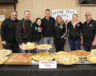 Neighbors | Abby Slanker.Bruno Bros Pizza brought enough pizza for everyone who attended the Canfield Choral Boosters and Canfield High School Choral Department’s Cinemagic Dinner Theater on Jan. 26.