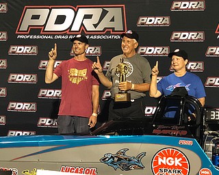 Ryan Martino, left, and his father Tom Martino, of Youngstown's Martino Motorsports, recently won the Professional Drag Racer Association Lucas Oil Top Dragster World Championship.