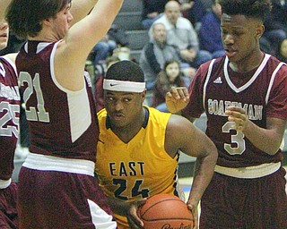 William D. Lewis The Vindicator  East'sJerall Jenkins(24) is hemmed in by Boardman's Cam Kreps(21) and Derrick Anderson(3) during 2-1-19 action at East.