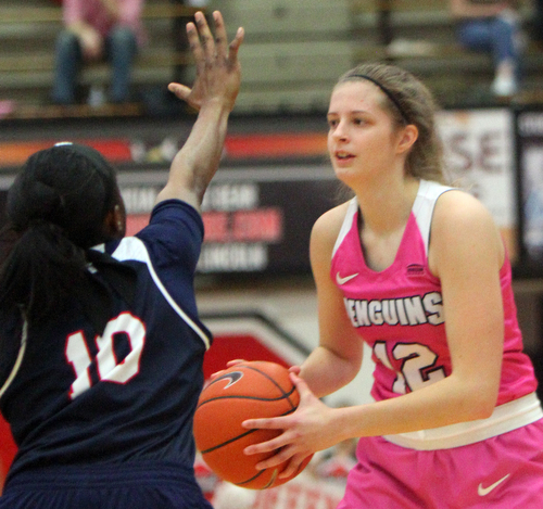 William D. Lewis The Vindicator YSU'sChelsea Olson(12) passes around Detroit's Brittney Jackson(10) during 2-2-19 action at YSU.