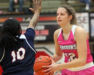 William D. Lewis The Vindicator YSU'sChelsea Olson(12) passes around Detroit's Brittney Jackson(10) during 2-2-19 action at YSU.