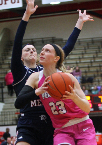 William D. Lewis The Vindicator YSU's Sarah Cash(23) drives around Detroit's Paige Bellman(43) during 2-2-19 action at YSU.