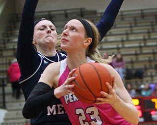 William D. Lewis The Vindicator YSU's Sarah Cash(23) drives around Detroit's Paige Bellman(43) during 2-2-19 action at YSU.