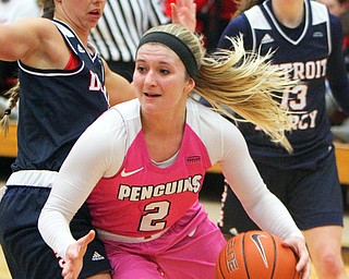 William D. Lewis The Vindicator YSU's Alison Smolinski(2) drives around Detroit'sLola Ristovski (3) during 2-2-19 action at YSU.