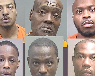 Six of the 12 people indicted by a federal grand jury for dealing in cocaine and heroin in Youngstown.