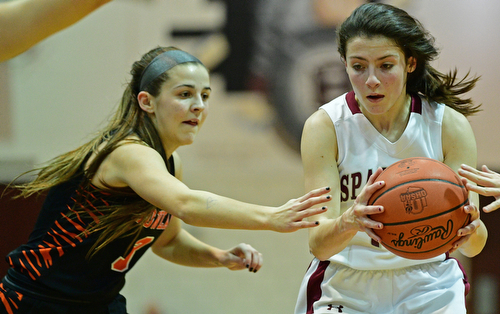 BOARDMAN, OHIO - FEBRUARY 4, 2019: Boardman's Raegan Burkey drives on Howland's Ashley Chambers during the first half of their game, Monday night at Boardman High School. DAVID DERMER | THE VINDICATOR