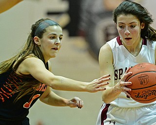 BOARDMAN, OHIO - FEBRUARY 4, 2019: Boardman's Raegan Burkey drives on Howland's Ashley Chambers during the first half of their game, Monday night at Boardman High School. DAVID DERMER | THE VINDICATOR