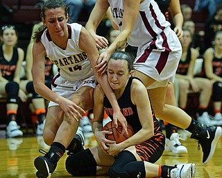 BOARDMAN, OHIO - FEBRUARY 4, 2019: Howland's Maria Dellimuti rips a loose ball away from Boardman's Emma Tokarsky during the first half of their game, Monday night at Boardman High School. DAVID DERMER | THE VINDICATOR