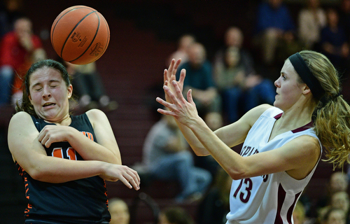 BOARDMAN, OHIO - FEBRUARY 4, 2019: Boardman's Cate Green loses control of the ball while Howland's Alyssa Pompelia protects herself during the first half of their game, Monday night at Boardman High School. DAVID DERMER | THE VINDICATOR