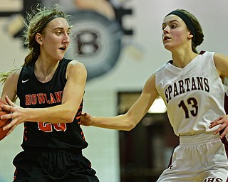 BOARDMAN, OHIO - FEBRUARY 4, 2019: Howland's Alex Ochman looks to pass against Boardman's Cate Green during the second half of their game, Monday night at Boardman High School. DAVID DERMER | THE VINDICATOR
