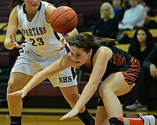 BOARDMAN, OHIO - FEBRUARY 4, 2019: Boardman's Maria Torres reaches for the loose ball as Howland's Alyssa Pompelia falls to the floor during the second half of their game, Monday night at Boardman High School. DAVID DERMER | THE VINDICATOR