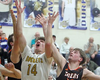 William D. Lewis The vindicator Lowellvilles Matt Hvisdak(14) shoots past Springfields Clay Medvec) during 2-5-19 action in Lowellville.