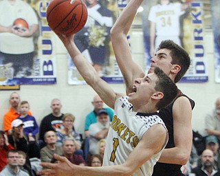 William D. Lewis The vindicator Lowellville's Micah Mamula Zarlinga(1) shoots past Springfields Drew Clark(2) during 2-5-19 action in Lowellville.