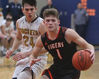 William D. Lewis The vindicator Springfield's Evan Ohlin(1) drives aroundLowellville's Joe Balone(24) during 2-5-19 action in Lowellville.