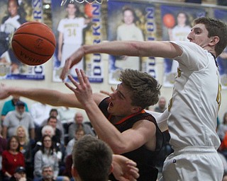 William D. Lewis The vindicator Lowellvilles Jack Rotz(15) swats the ball from Sprinfield's Clay Medvec(10)shoots past Springfields Evan Ohlin(1) during 2-5-19 action in Lowellville.