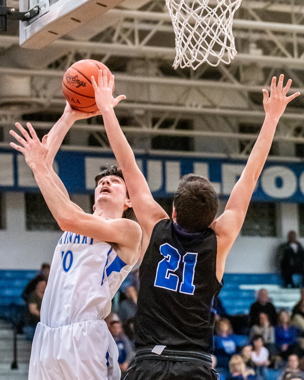 DIANNA OATRIDGE | THE VINDICATOR Poland's Daniel Kramer (10) puts up a shot over Lakeview's Jeff Remmick (21) during the Battle of the Bulldogs at Poland High School on Tuesday night.