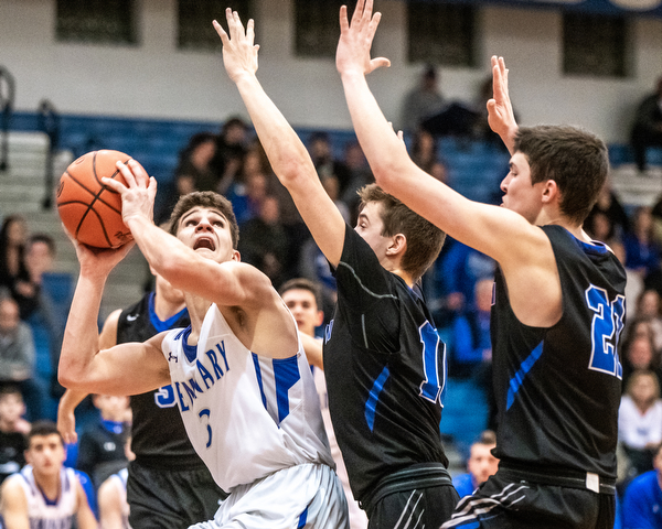 DIANNA OATRIDGE | THE VINDICATOR Poland's Braeden O'Shaughnessy (3) looks to score against Lakeview's double team of AJ McClellan (10) and Jeff Remmick (21) during the Battle of the Bulldogs at Poland High School on Tuesday night.