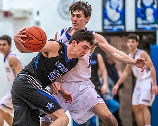 DIANNA OATRIDGE | THE VINDICATOR Lakeview's Jeff Remmick (21) drives against Poland's Daniel Kramer during the Battle of the Bulldogs at Poland High School on Tuesday night.