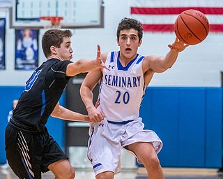 DIANNA OATRIDGE | THE VINDICATOR Poland's Adam Kassem (20) passes the ball as Lakeview's AJ McClellan(10) defends during the Battle of the Bulldogs at Poland High School on Tuesday night.