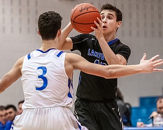 DIANNA OATRIDGE | THE VINDICATOR Lakeview's AJ McClellan (10) looks to pass around Poland's Braeden O'Shaughnessy  (3) during the Battle of the Bulldogs at Poland High School on Tuesday night.