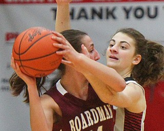 William D. Lewis The Vindicator Boardman's Emma Tokarsky(14) drives around Canfield's Gianna Flask(10).