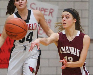 William D. Lewis The Vindicator Boardman's Kate Green(13)passes around around Canfield's Serena Sammarone(54).).