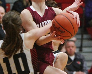 William D. Lewis The Vindicator Boardman's Raegan Burkey(15) collides with Canfield's Gianna Flask(10) .