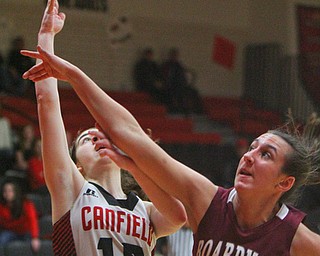 William D. Lewis The Vindicator Boardman's Emma Tokarsky(14) tries to block a shot from Canfield's Gianna Flask(10).