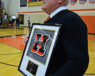 HOWLAND, OHIO - FEBURARY 6, 2019:Howland head coach John Diehl holds a plaque given to him after Howland defeated Lakeside 89-40, Wednesday night at Howland High School. The win was Diehl's 500th career win. DAVID DERMER | THE VINDICATOR