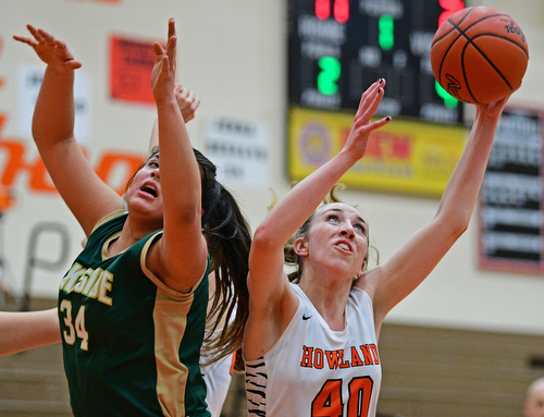 HOWLAND, OHIO - FEBRUARY 6, 2019: Howland's Kayla Clark grabs a rebound away from Lakeside's Hailee Aguinaga during the first half of their game, Wednesday night at Howland High School. Howland won 89-40. DAVID DERMER | THE VINDICATOR