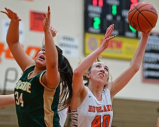 HOWLAND, OHIO - FEBRUARY 6, 2019: Howland's Kayla Clark grabs a rebound away from Lakeside's Hailee Aguinaga during the first half of their game, Wednesday night at Howland High School. Howland won 89-40. DAVID DERMER | THE VINDICATOR