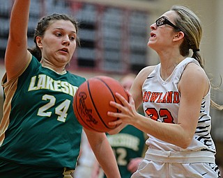 HOWLAND, OHIO - FEBRUARY 6, 2019: Howland'sMakayla Dahman drives on Lakeside's Brielle Hathy during the first half of their game, Wednesday night at Howland High School. Howland won 89-40. DAVID DERMER | THE VINDICATOR