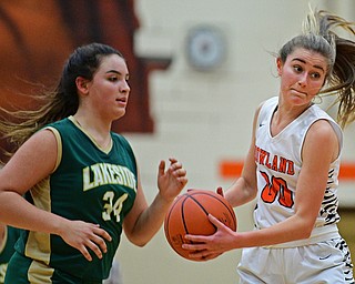 HOWLAND, OHIO - FEBRUARY 6, 2019: Howland's Jenna Craigo catches a pass while being chased by Lakeside's Hailee Agunaga during the first half of their game, Wednesday night at Howland High School. Howland won 89-40. DAVID DERMER | THE VINDICATOR