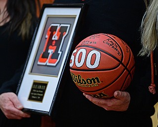 HOWLAND, OHIO - FEBURARY 6, 2019:Howland head coach John Diehl holds a basketball and plaque given to him to celebrate his 500th career win after Howland defeated Lakeside 89-40, Wednesday night at Howland High School. DAVID DERMER | THE VINDICATOR